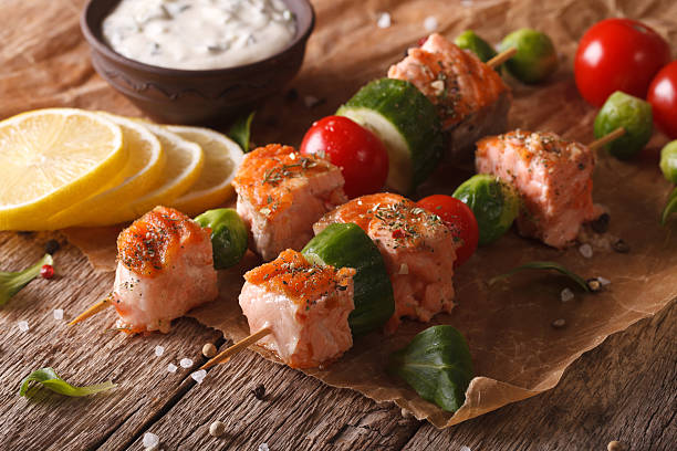 istock Kebab salmon, vegetables and tartar sauce close-up. horizontal 611198662