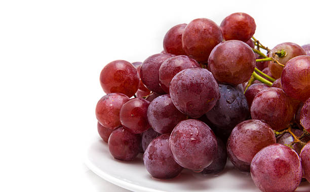 istock Red Grapes on a white background - close-up 611199340