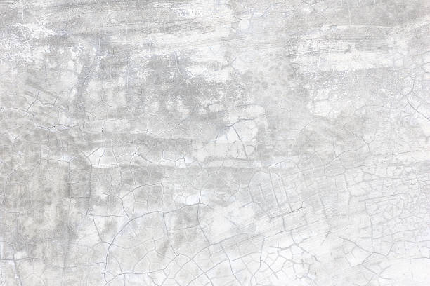 istock Grunge concrete cement wall with crack in building 611199398
