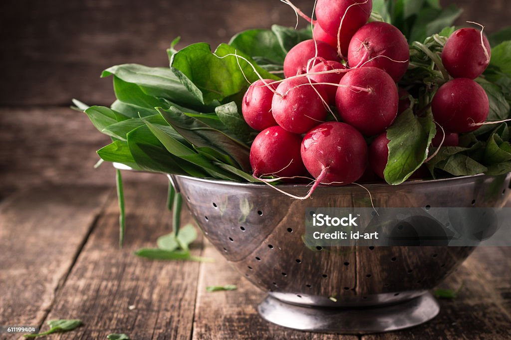 fresh vegetables in a metal colander ,healthy food fresh vegetables in a metal colander ,healthy food on a wooden vintage table Radish Stock Photo
