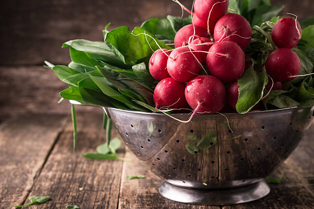 fresh vegetables in a metal colander ,healthy food fresh vegetables in a metal colander ,healthy food on a wooden vintage table spring mix lettuce leaves stock pictures, royalty-free photos & images
