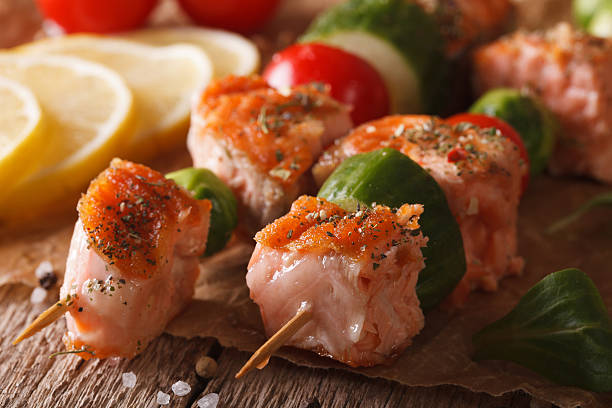istock Grilled salmon with vegetables on skewers  macro. horizontal 611199744