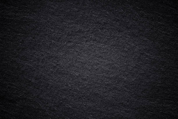 istock Dark grey black slate background or natural stone texture. 611199810