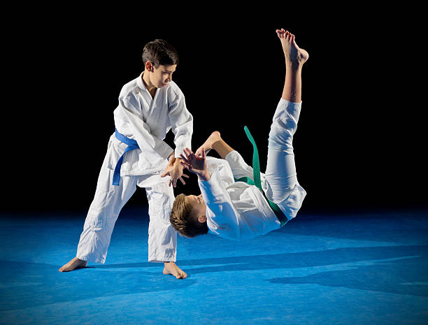 istock Children martial arts fighters 611200036