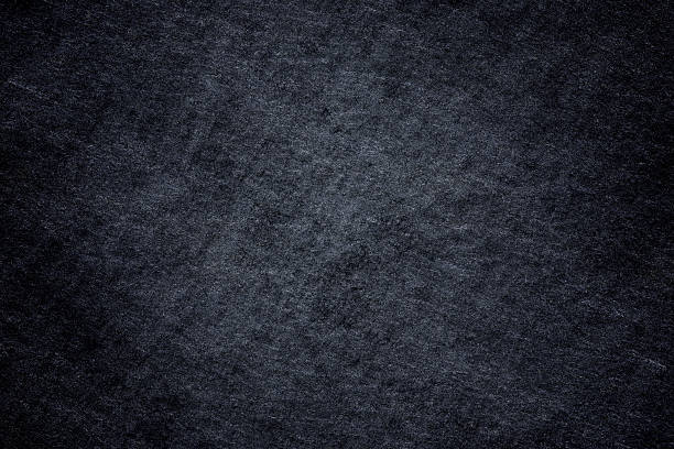 istock Dark grey black slate background or natural stone texture. 611200306