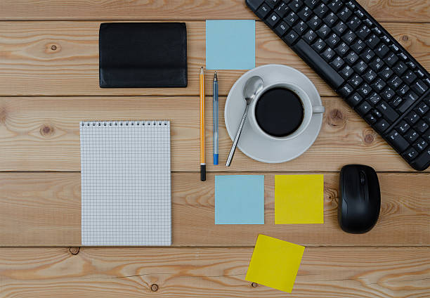 istock keyboard, colored stickers cup of coffee wallet and office suppl 611200428