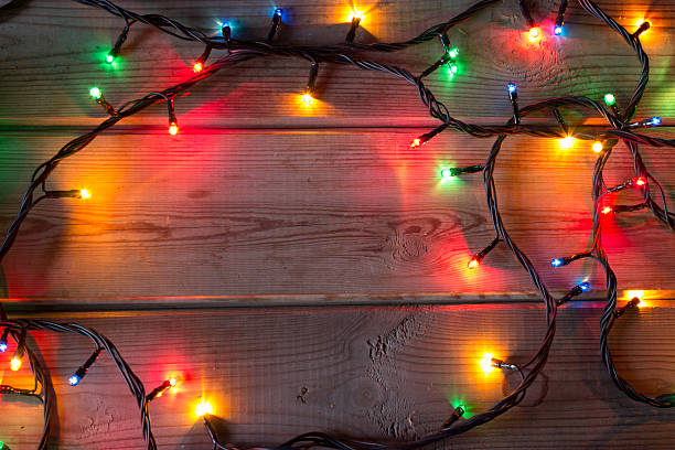 istock Christmas tree garland on wooden table 611200760