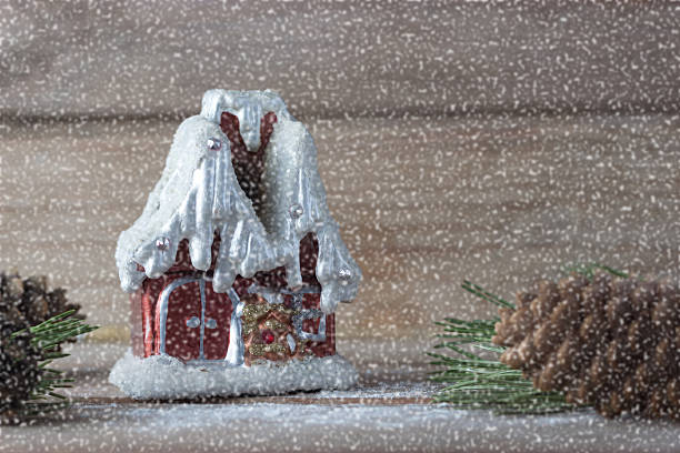 istock winter house candle and Christmas tree branches 611201150