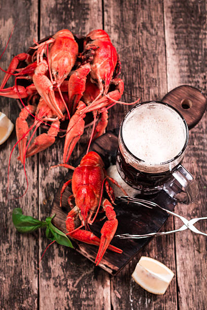 istock boiled crawfish and beer on a wooden background 611201192