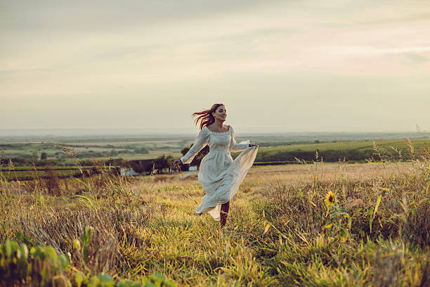 istock Young woman in a meadow 611202936