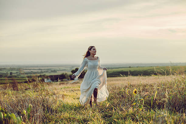 istock Young woman in a meadow 611202994