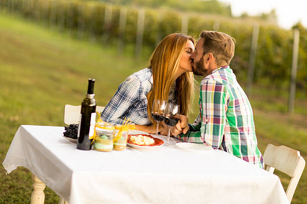 Couple having dinner vineyard