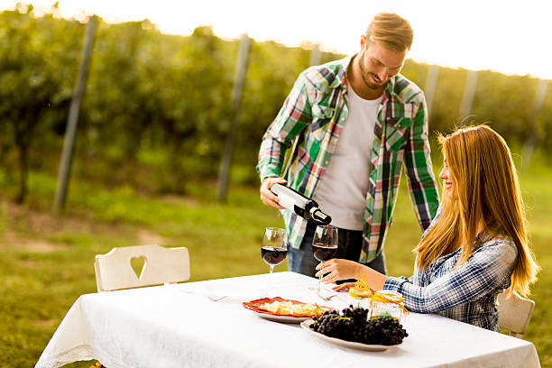 Couple having dinner vineyard