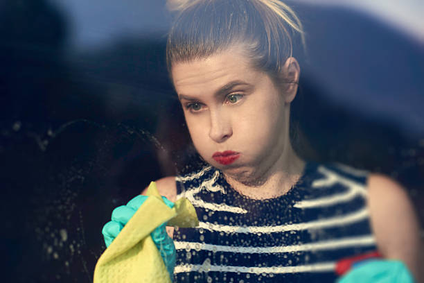 istock tired of cleaning window 611204450