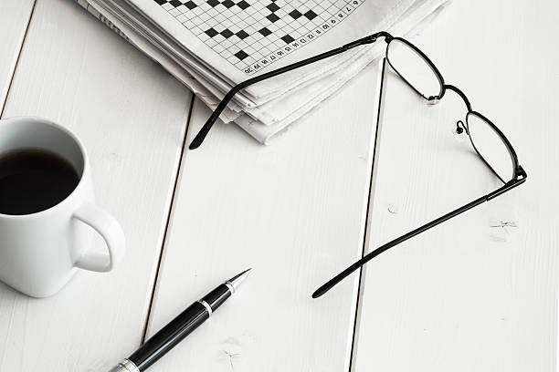 istock Crossword and pencil on wooden background 611205154