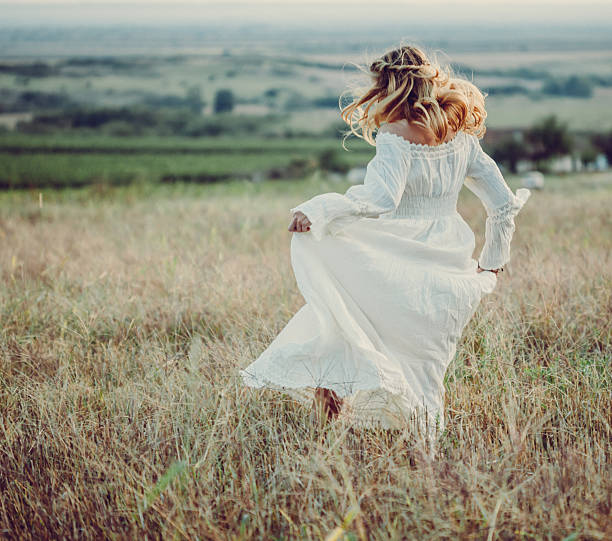 istock Young woman in a meadow 611205272
