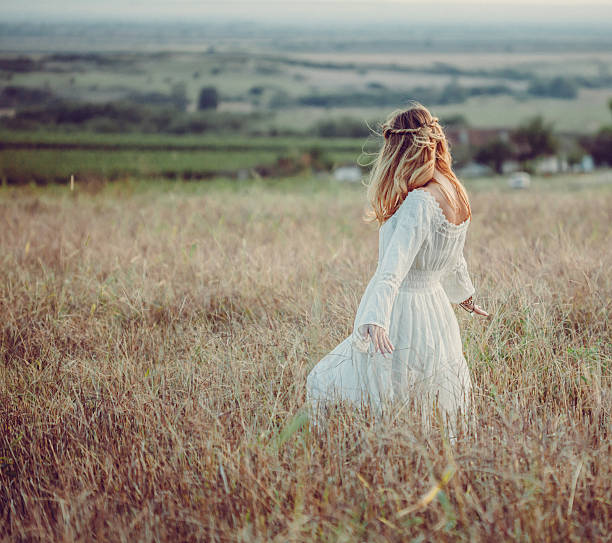 istock Young woman in a meadow 611205512