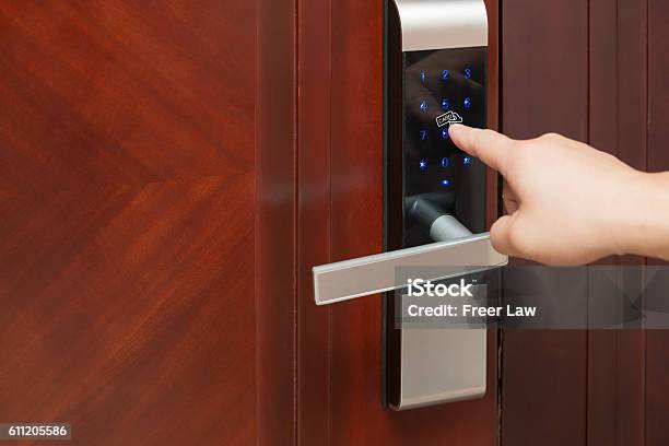 Inputing Passwords On An Electronic Door Lock Stock Photo - Download Image Now - Lock, Intelligence, Door