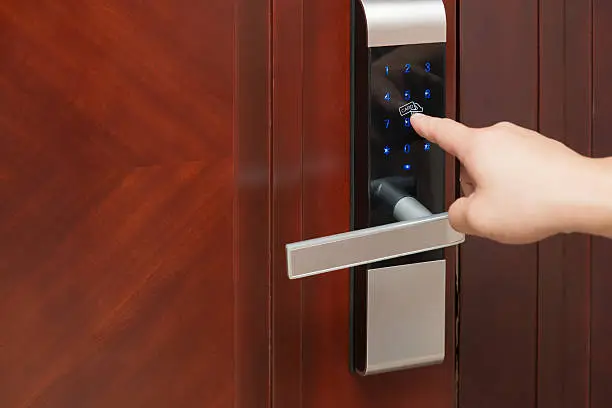 Photo of inputing passwords on an electronic door lock