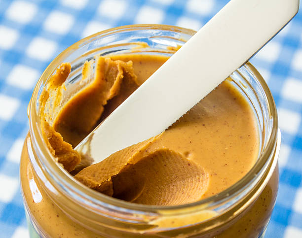 istock creamy peanut butter in a jar 611205880