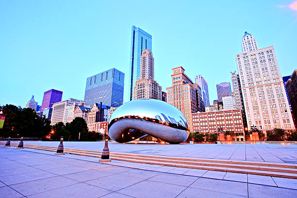 Cloud Gate in Millennium Park at Sunrise, Chicago Chicago, United States - September 3, 2015: Cloud Gate in Millennium Park. The Cloud Gate is a major tourist attraction and a gate to traditional Chicago Jazz Fest. millennium park stock pictures, royalty-free photos & images