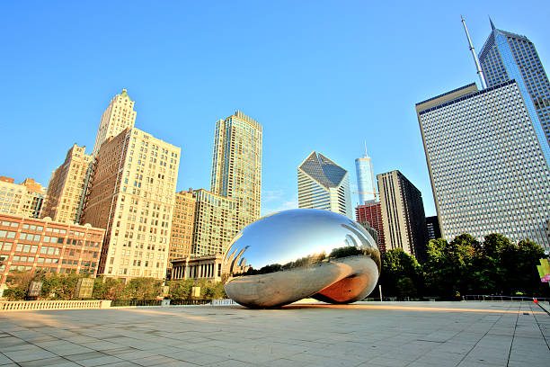 Cloud Gate in Millennium Park at Sunrise, Chicago Chicago, United States - September 3, 2015: Cloud Gate in Millennium Park. The Cloud Gate is a major tourist attraction and a gate to traditional Chicago Jazz Fest. millennium park stock pictures, royalty-free photos & images