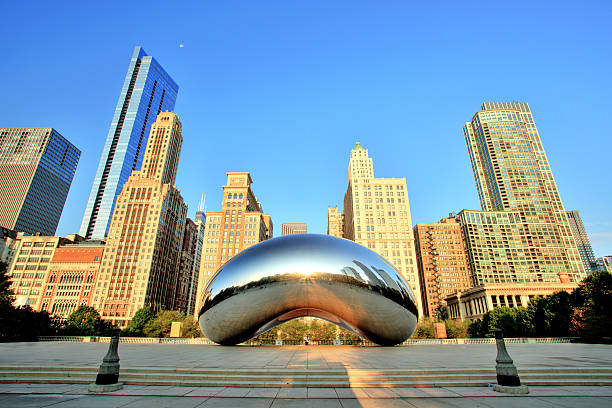 Cloud Gate in Millennium Park at Sunrise, Chicago Chicago, United States - September 3, 2015: Cloud Gate in Millennium Park. The Cloud Gate is a major tourist attraction and a gate to traditional Chicago Jazz Fest. millennium park chicago stock pictures, royalty-free photos & images