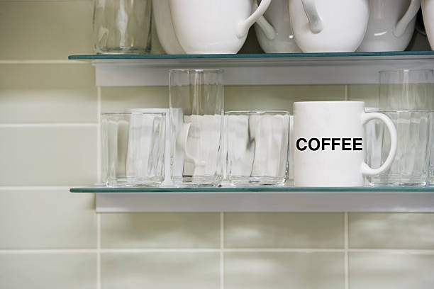 istock Mug on shelf with the words coffee 611208432