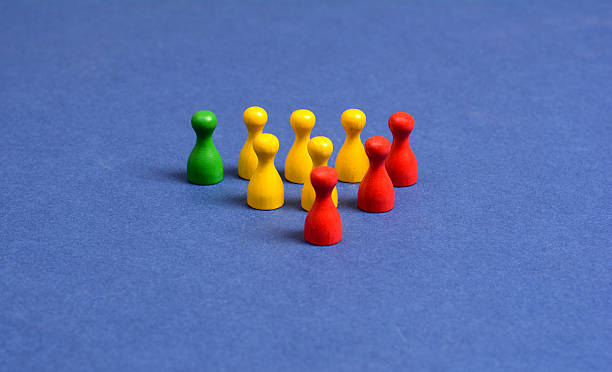 istock Colorful playing pawns on blue background 611208728