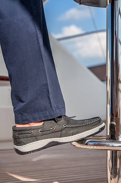 cropped leg on boat deck - men railing passenger ship shipping imagens e fotografias de stock