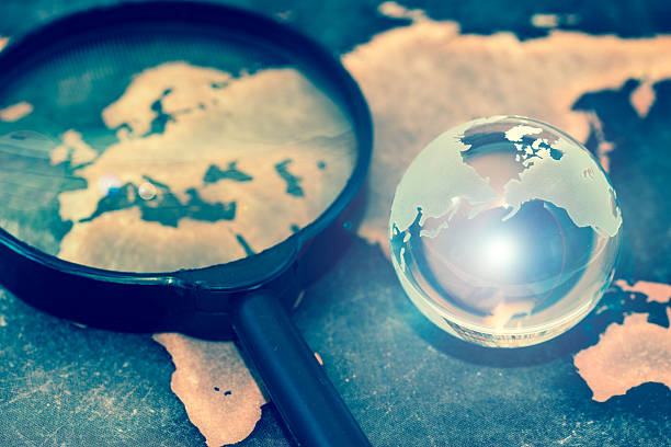 istock Crystal globe on grunge world map, with lens flare 611211978