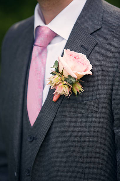 istock groom's buttonhole from pink rose and a tie 611212030