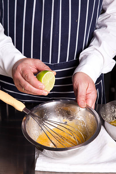 istock Chef season with lemon beaten up eggs 611212816