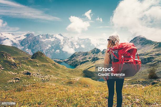 Woman With Backpack Enjoying Mountains Landscape View Hiking Stock Photo - Download Image Now