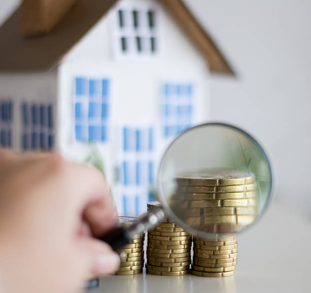 istock Mortgage concept focused on the magnifying glass 611213188