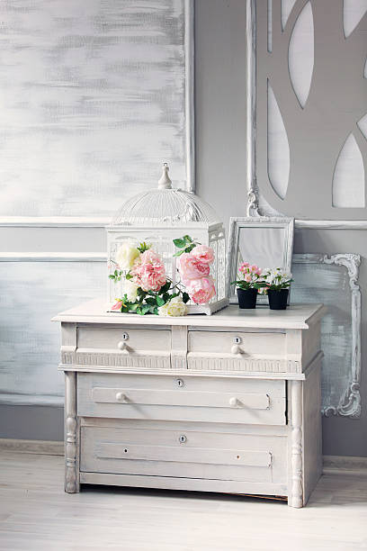 istock dresser with flowers in a light classical interior 611214428