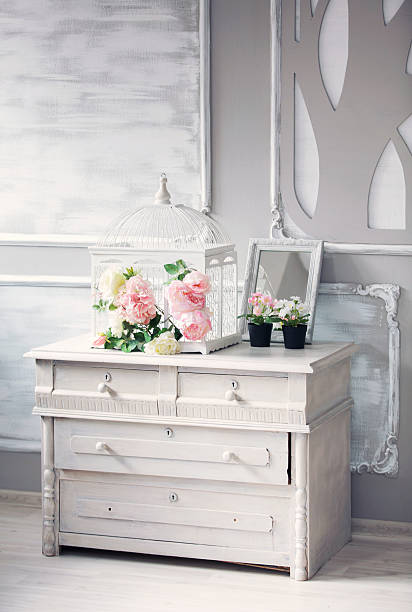istock dresser with flowers in a light classical interior 611214474