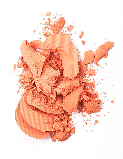 istock Orange color Face make up powder cracked on background 611290854