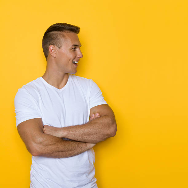 istock Shouting Man In White Shirt Against Yellow Background 611290870
