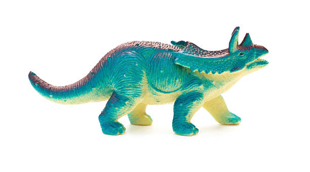 istock side view blue  Pentaceratops toy on a white background 611291392