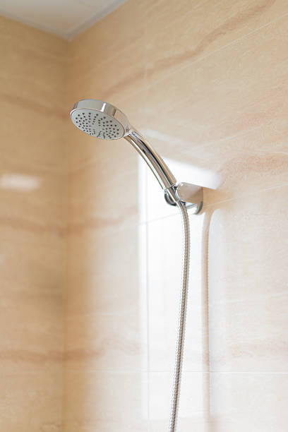 istock stainless steel shower head in bathroom 611291768