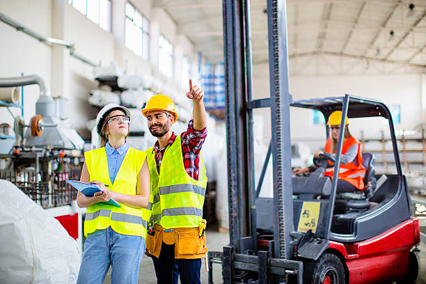 istock Young engineers in a factory 611291808