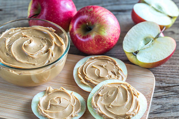 istock Slices of apples with peanut butter 611292244