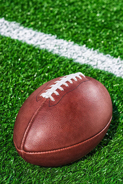 istock Looking down on a leather American Football 611294092