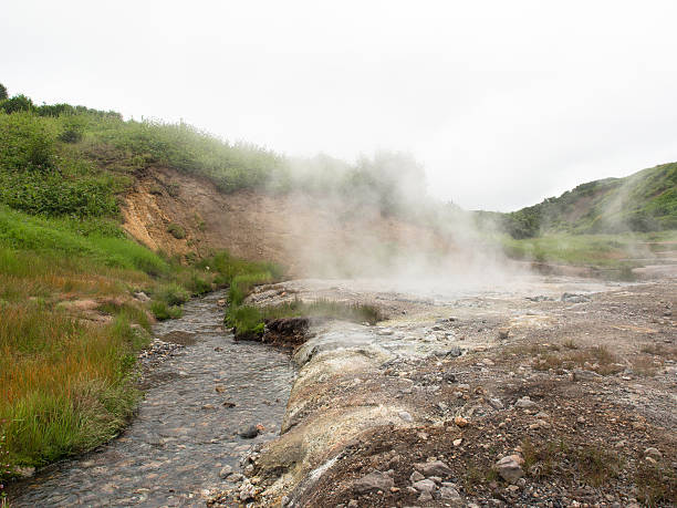 istock Hot stream flows in smoking crater  volcano Mutnovsky 611294114