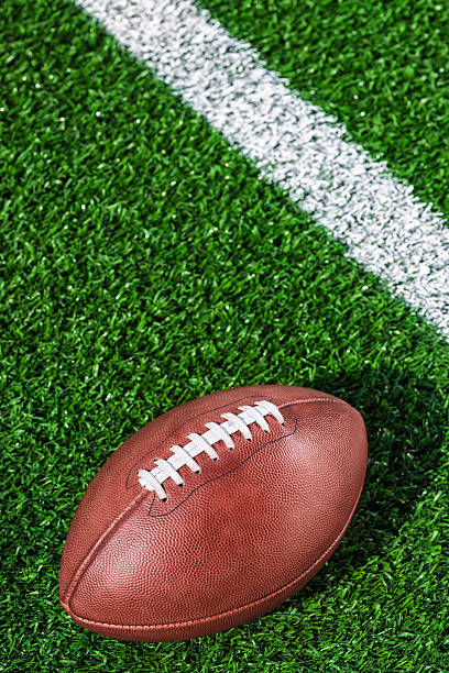 istock Looking down on a leather American Football 611294128