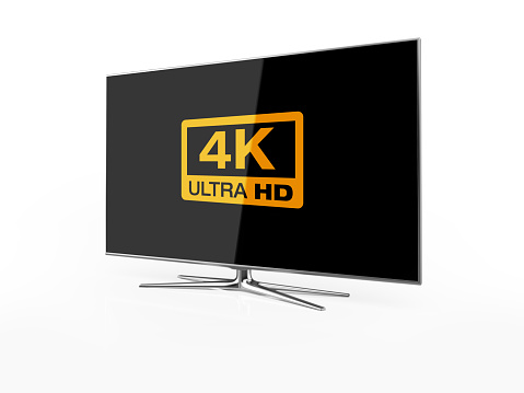 UHD 4K Smart Tv standing on white background. Sidet view. There is 4K Logo on the display. Clipping path is included.