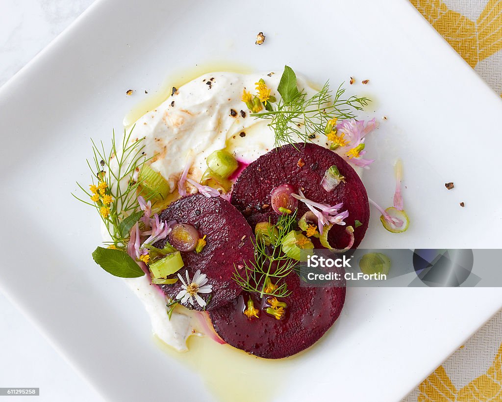 Gourmet Beet Salad Close Up An artfully plated beet salad dish on a white square plate. Gourmet Stock Photo