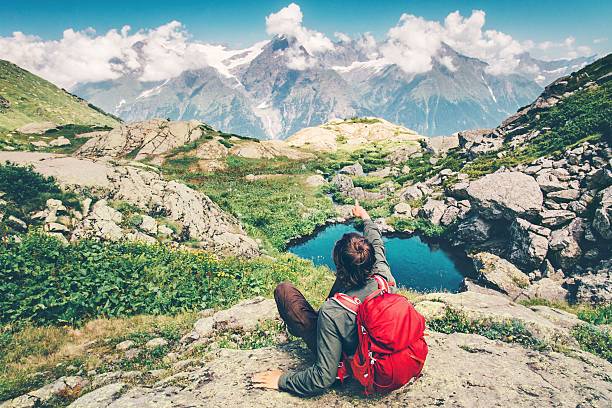 istock Traveler Man with backpack relaxing hand showing destination Travel Lifestyle 611295334