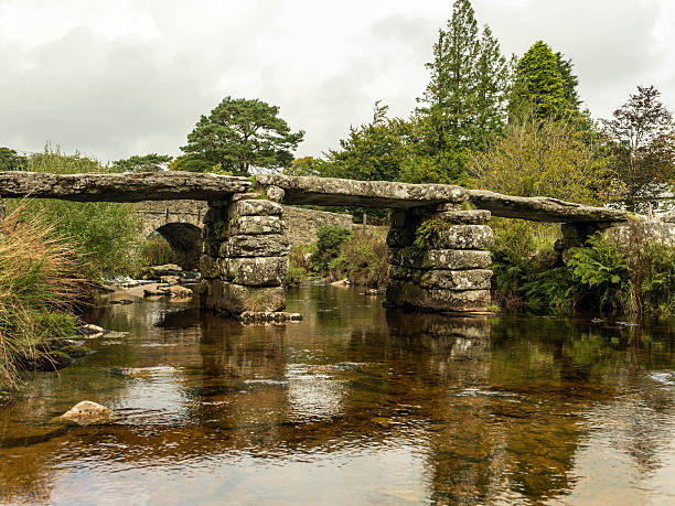 istock Landscape featuring a stone bridge and East Dart river 611297450